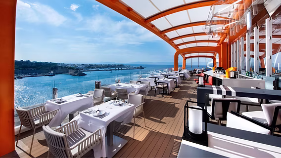 Celebrity Edge cruise ship Magic Carpet platform overlooking the ocean