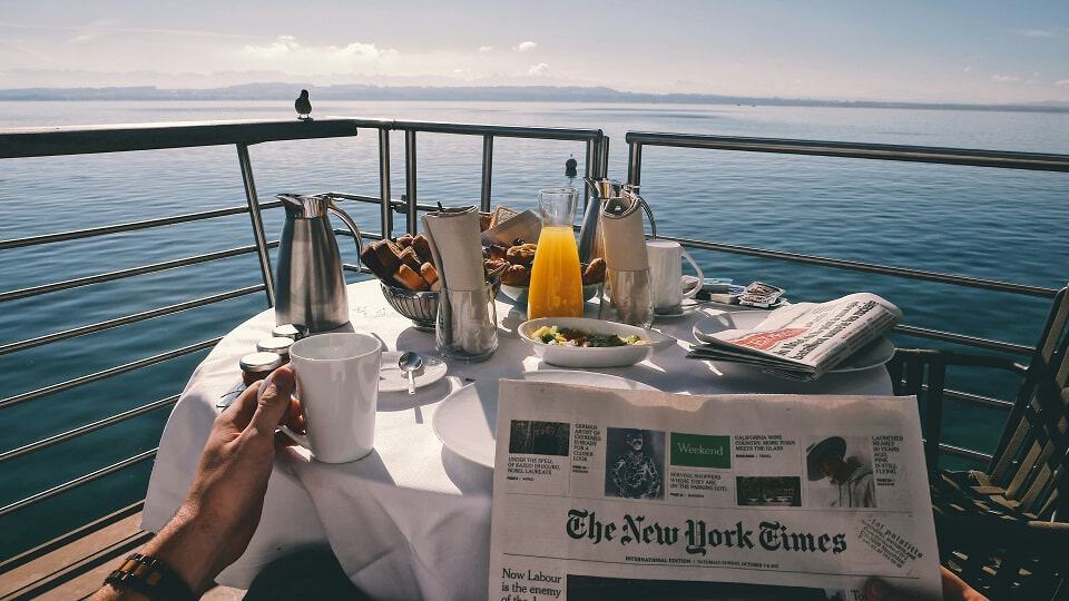 Luxury European river cruise breakfast on a private balcony with scenic river views and morning coffee