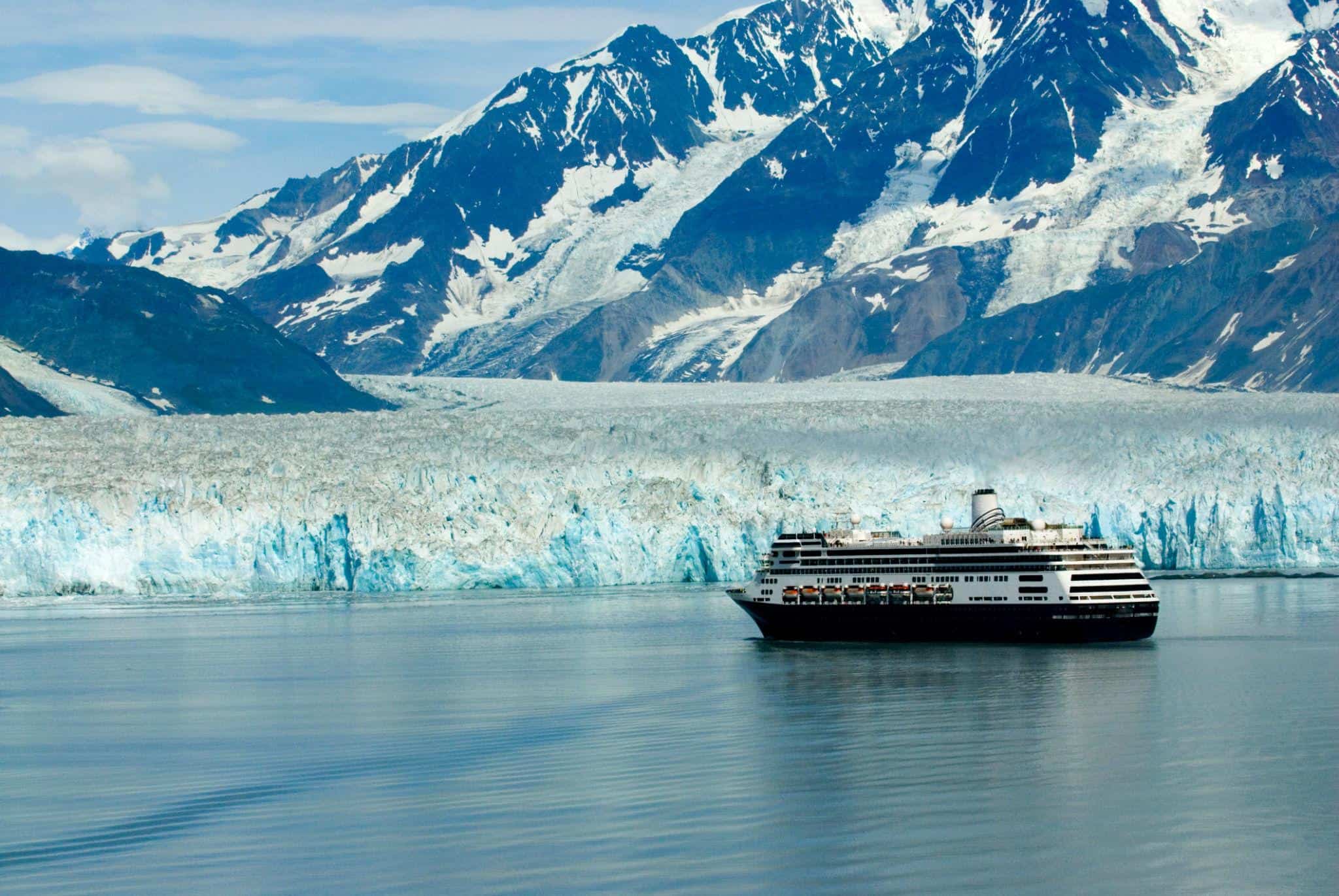 Princess cruise ship sailing past an Alaska glacier during scenic cruising.