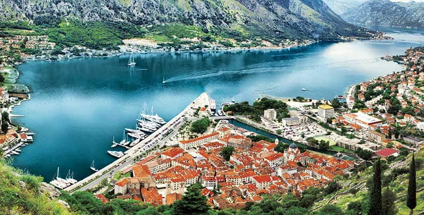Small cruise ship docked in a small coastal town close to the village center