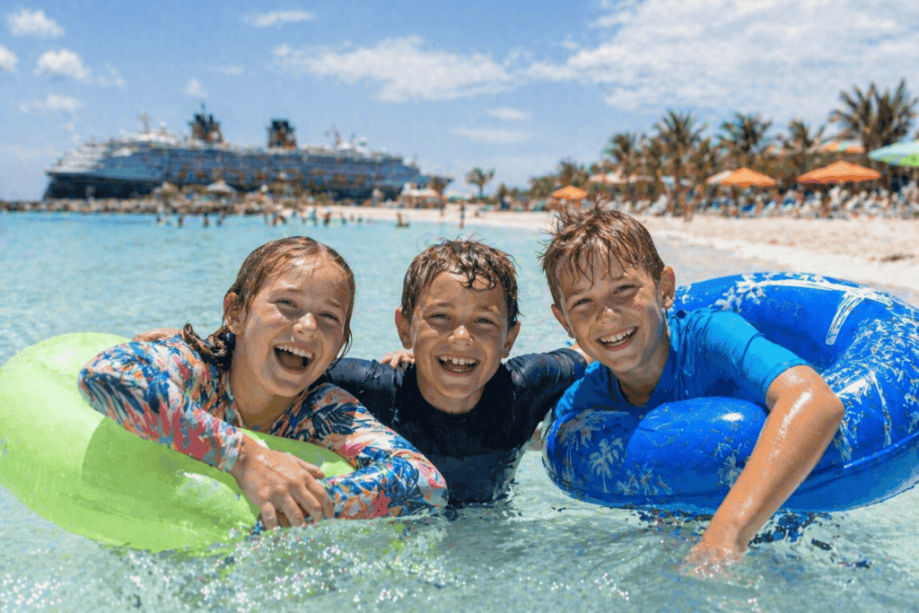 Kids playing in a cruise ship pool on a sunny day during a family vacation