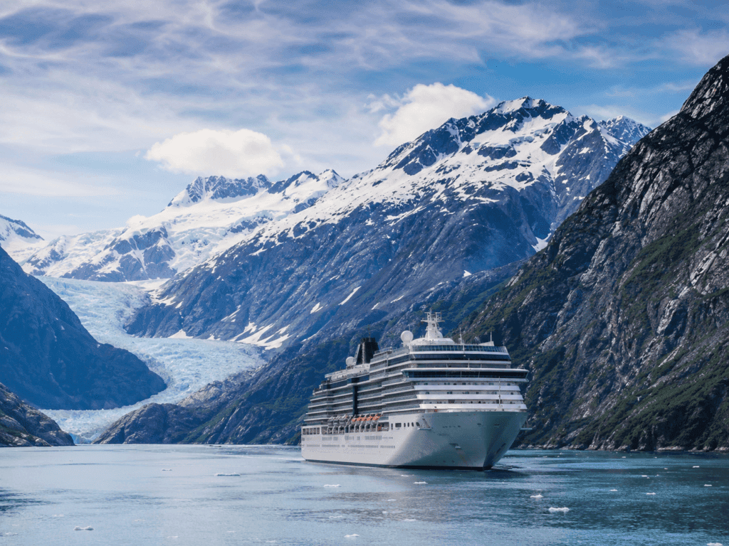 Best Alaska cruise lines for first-timers compared — cruise ship sailing past glaciers in Alaska's Inside Passage
