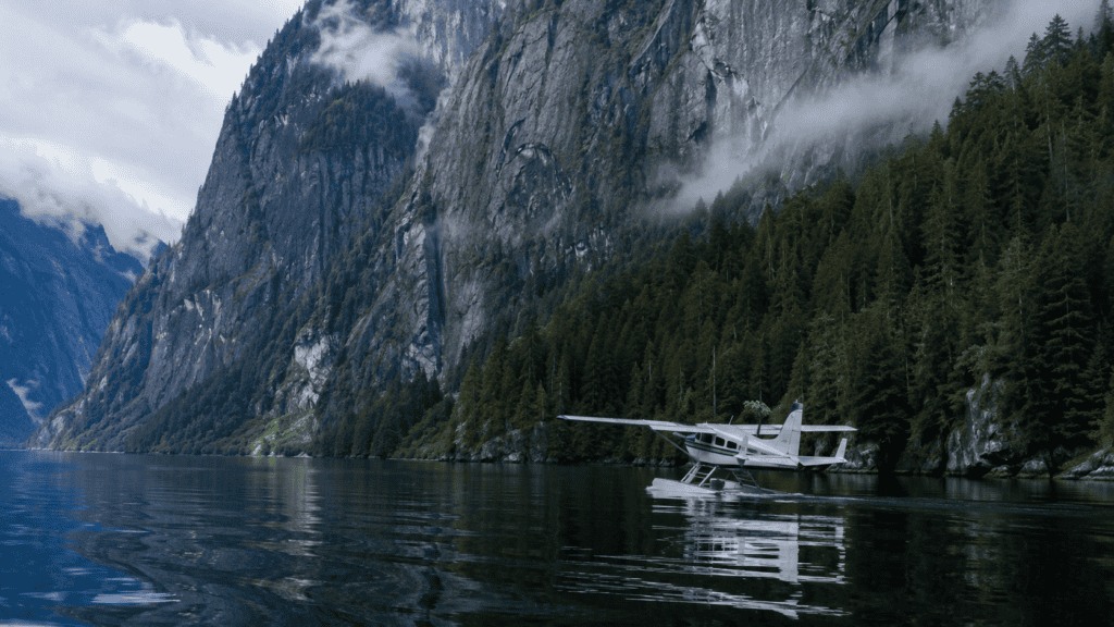 Floatplane on glassy lake inside Misty Fjords National Monument near Ketchikan Alaska