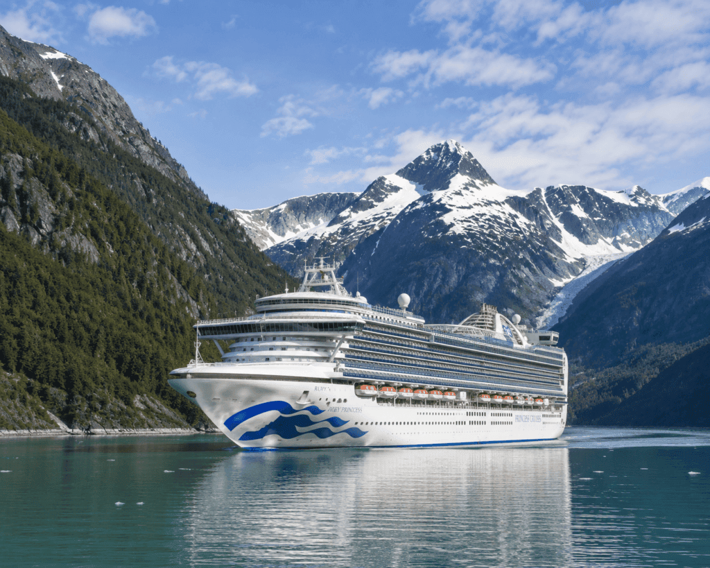Princess cruise ship sailing Alaska Inside Passage with glaciated mountains, 2026