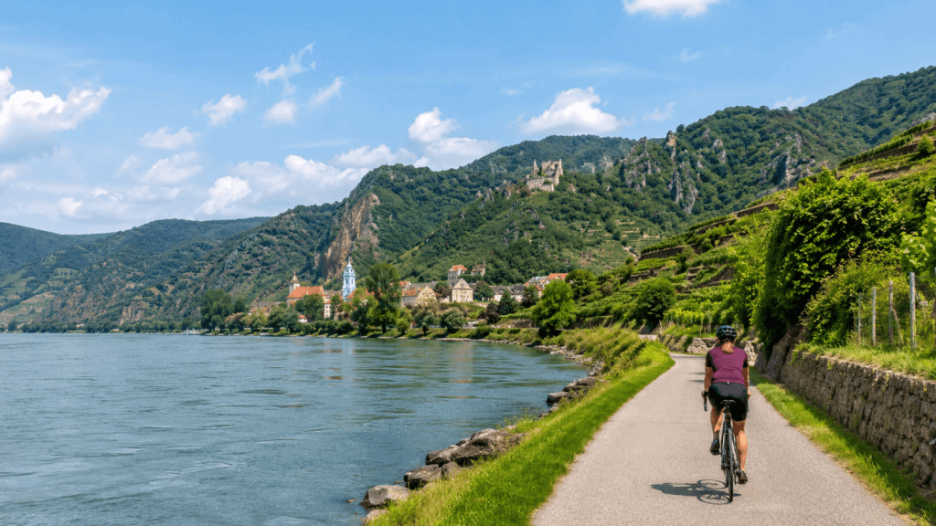 Cyclist on a riverside path through the Wachau Valley on an active European river cruise
