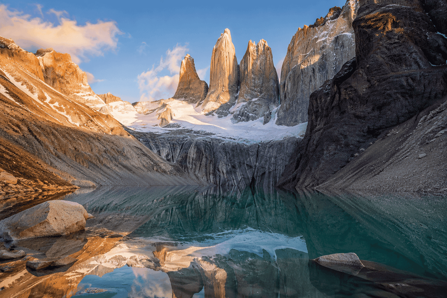 Torres del Paine granite towers reflected in glacial lake in Patagonia, Chile, ideal for an extreme adventure honeymoon