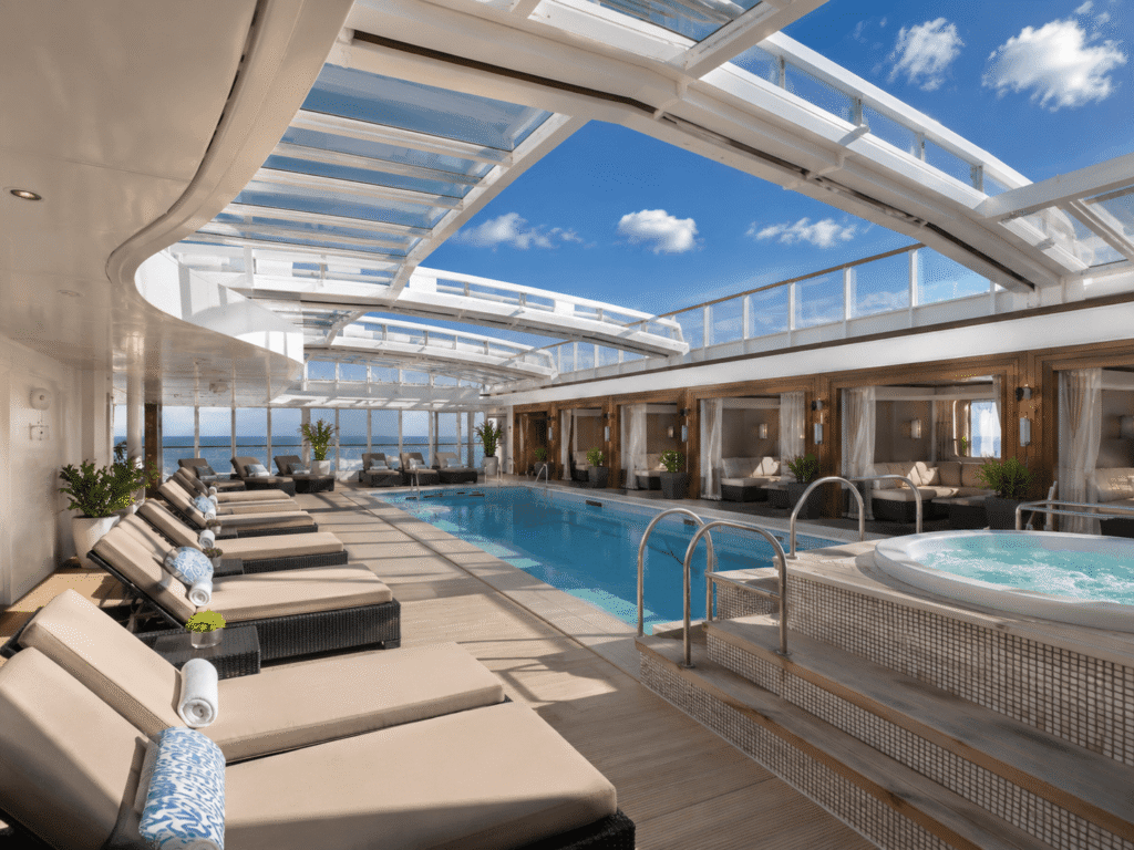 NCL Haven private sundeck with loungers and hot tubs on a Norwegian ship
