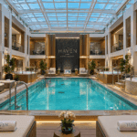 Norwegian Bliss Haven Courtyard pool on deck 17 with the retractable glass roof closed over the water